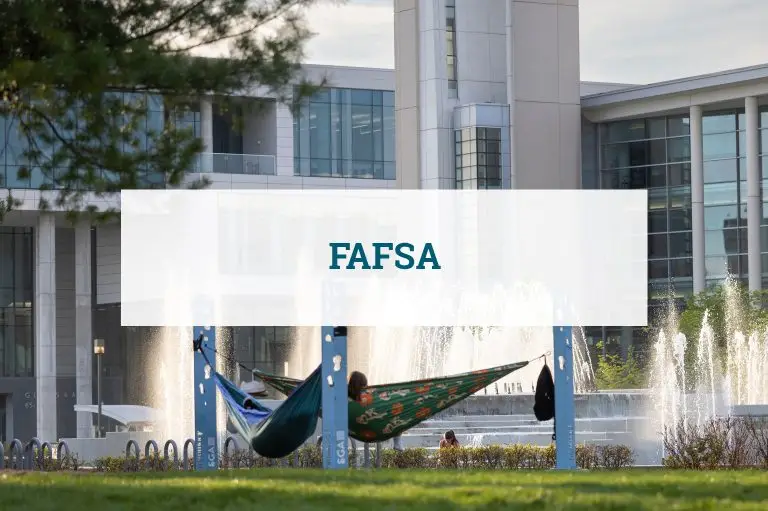 Students studying in hammocks on a college campus. There is a banner across the photo that says FAFSA.